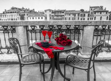 Assaf Frank - Bunch of Roses with wine glasses and female hand gloves on cafe table, Venice, Italy