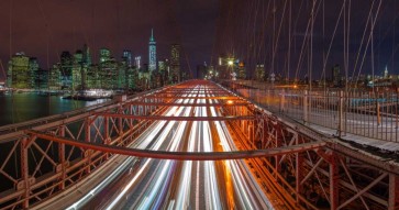 Assaf Frank - Evening view of Manhattan skyline from Brooklyn bridge