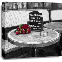 Assaf Frank - Bunch of flowers on sidewalk cafe table, Paris, France